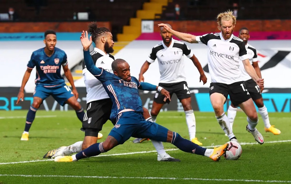 Arsenal's Alexandre Lacazette in action with Fulham's Michael Hector and Tim Ream. (Reuters)